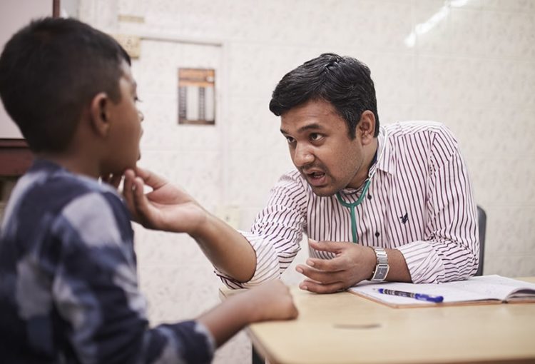 A doctor conducting a general health check up.