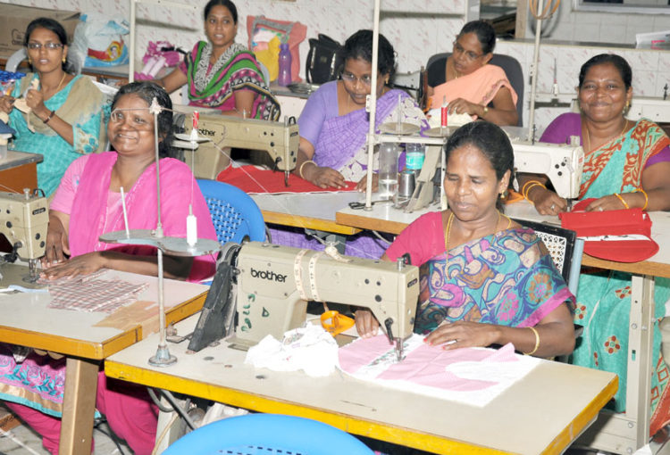 A busy day for the women at the handicraft center, as they seek to fulfil their orders for the month.